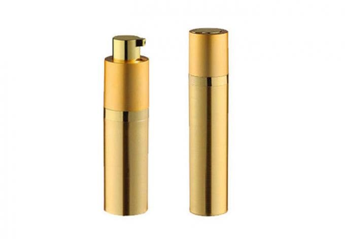 Garrafa cosmética cilíndrica dourada da bomba de vácuo